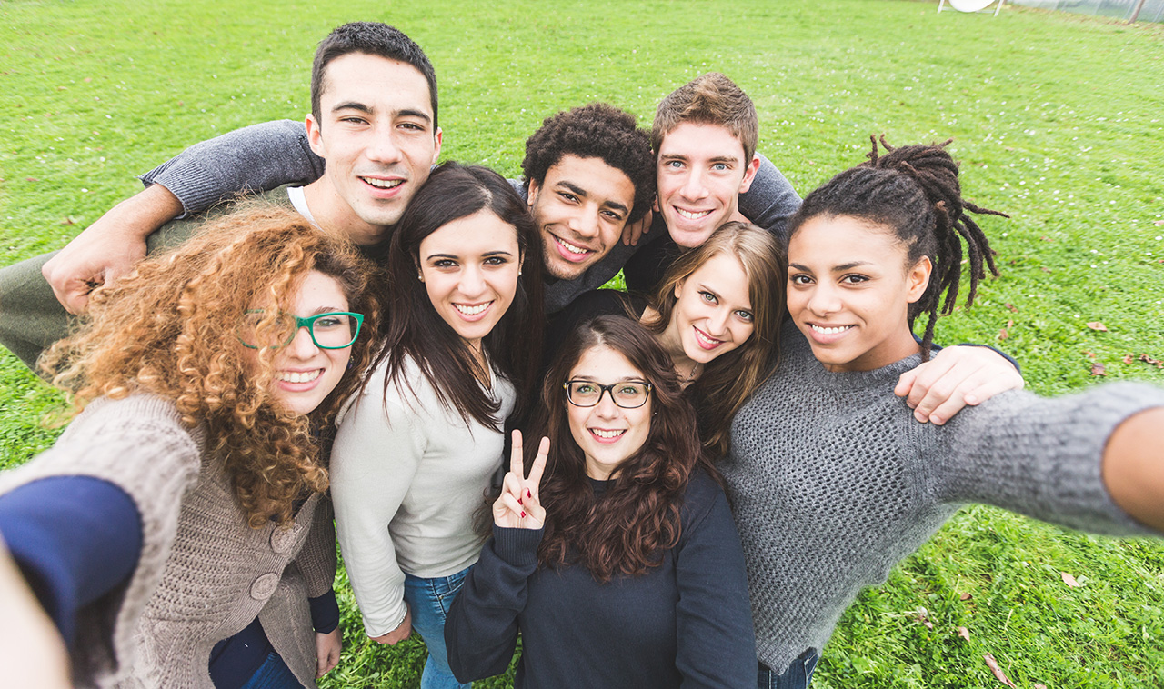 Multiethnic Group of Friends Taking Selfie